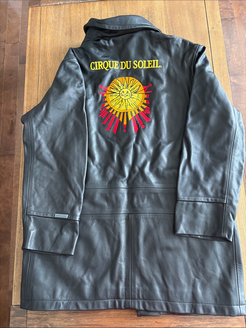 Black Leather Trench Coat with Sun Emblem